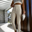 Leggings ajustados de color liso para mujer con botones a la moda